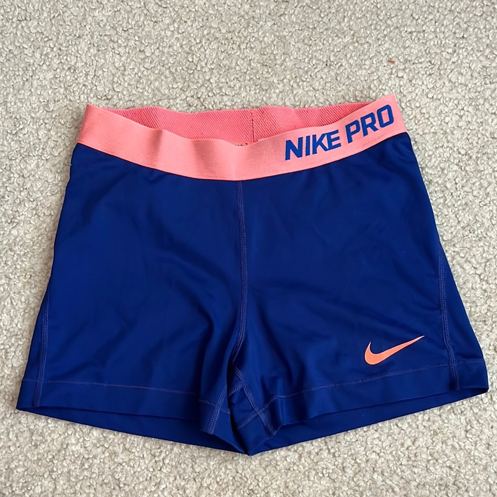 Blue and pink Nike Pros